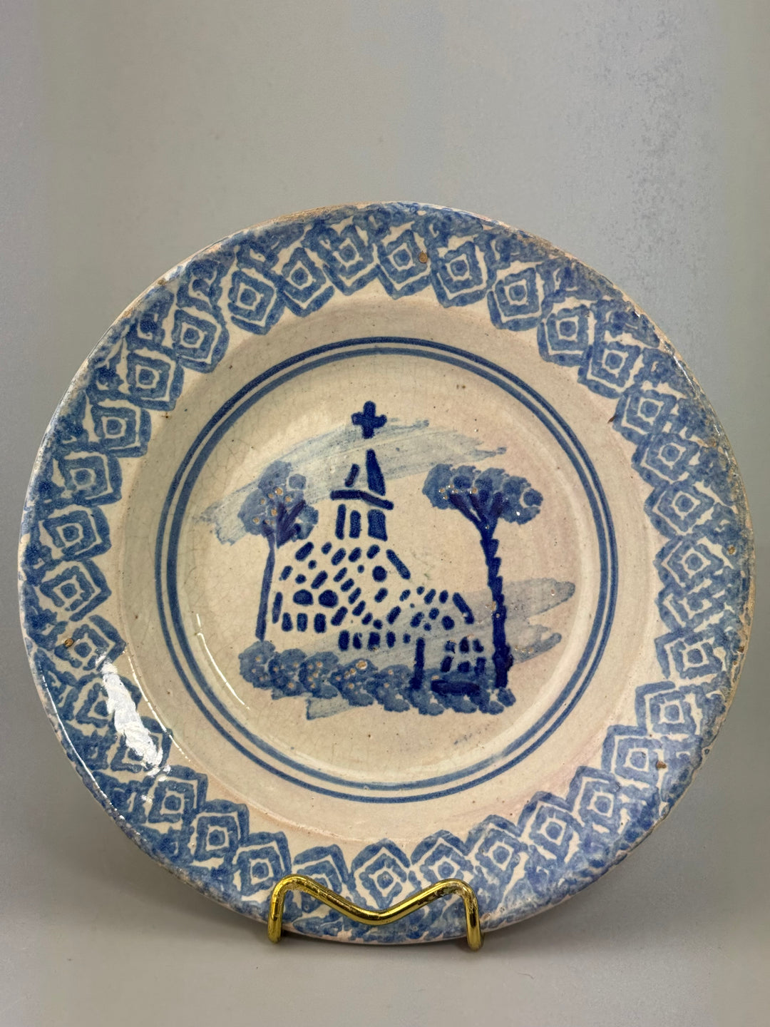 Piatto in maiolica decorata in blu produzione popolare italiana