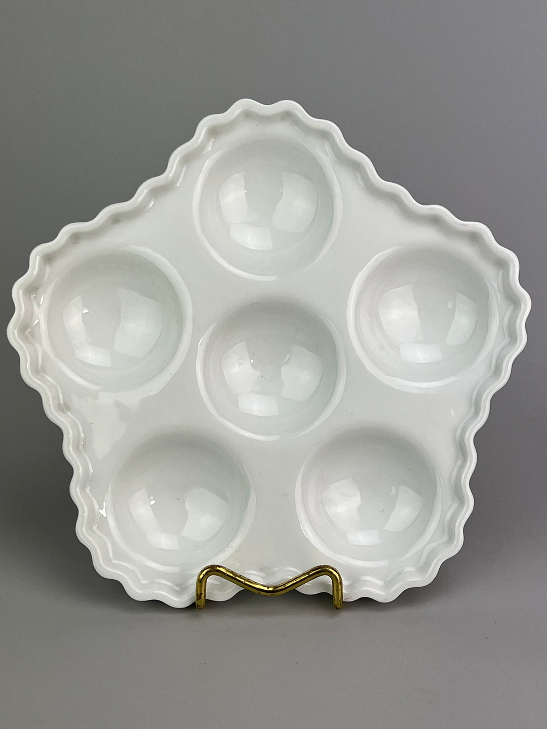 Piatto in porcellana bianca portalumache