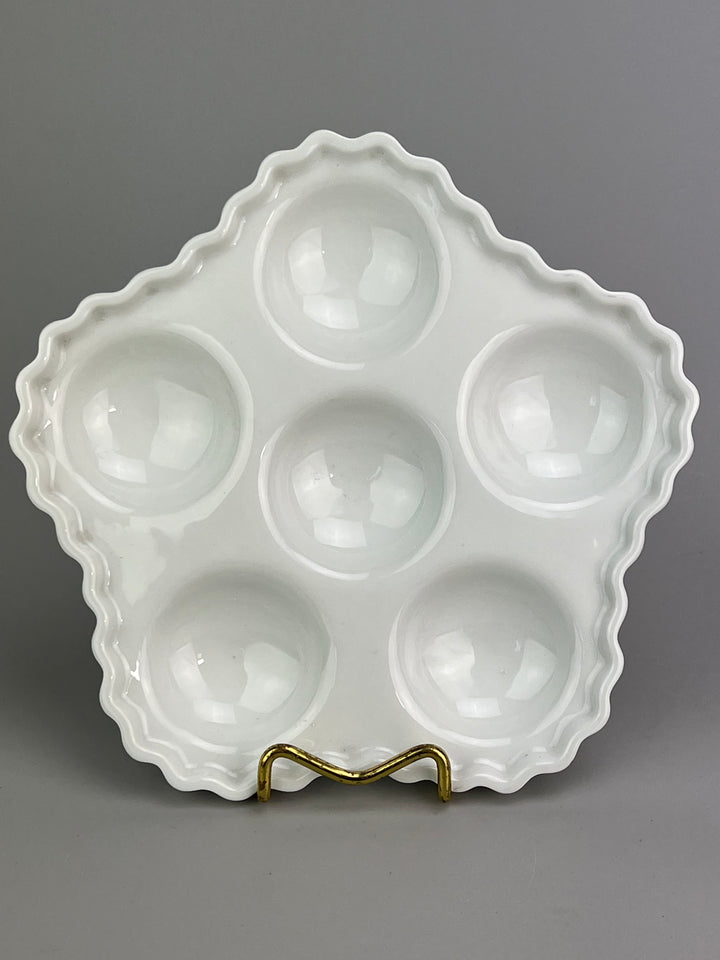 Piatto in porcellana bianca portalumache