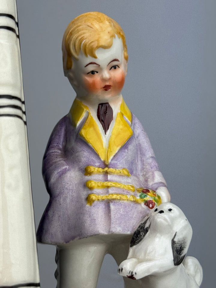 Coppia di fermalibri vintage in porcellana dipinta con bambini e cagnolini metà XX secolo