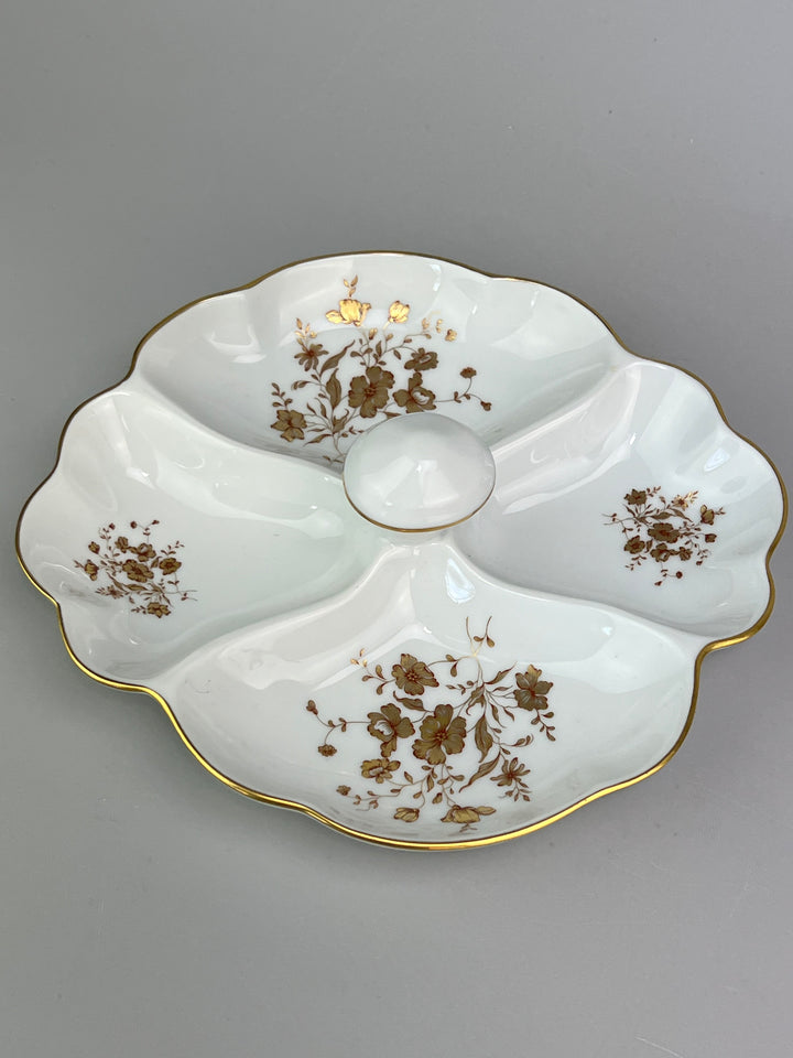 Piatto in porcellana Limoges con decoro dorato