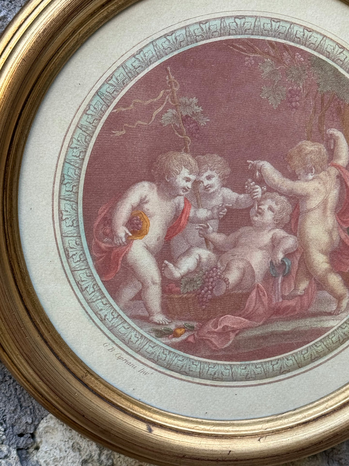 Stampe tonde con raffigurazione putti con cornici dorate