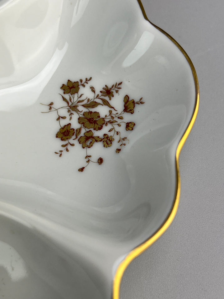 Piatto in porcellana Limoges con decoro dorato