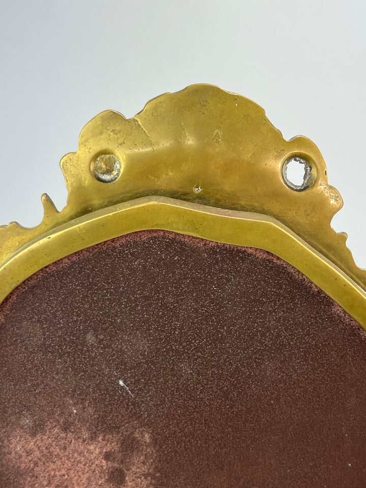Specchio da tavolo in bronzo dorato con putti stile rococò