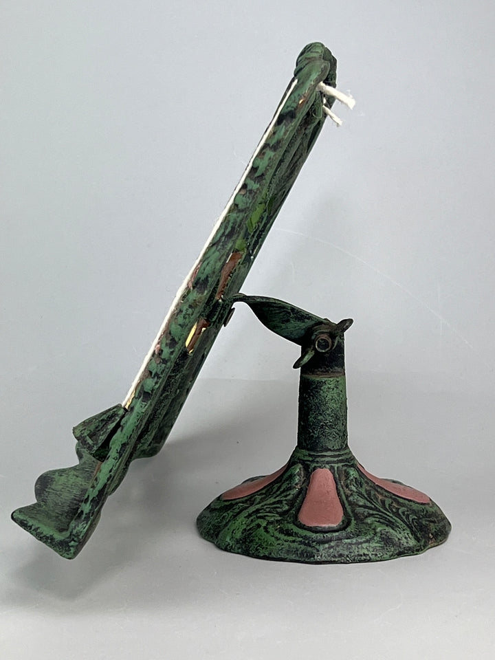 Leggio vintage in ghisa decorata scena con papere