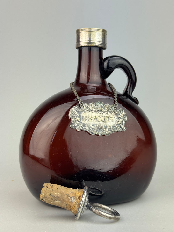 Bottiglia Decanter Brandy in vetro soffiato ambra targa silverplate vintage
