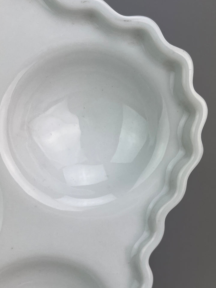 Piatto in porcellana bianca portalumache