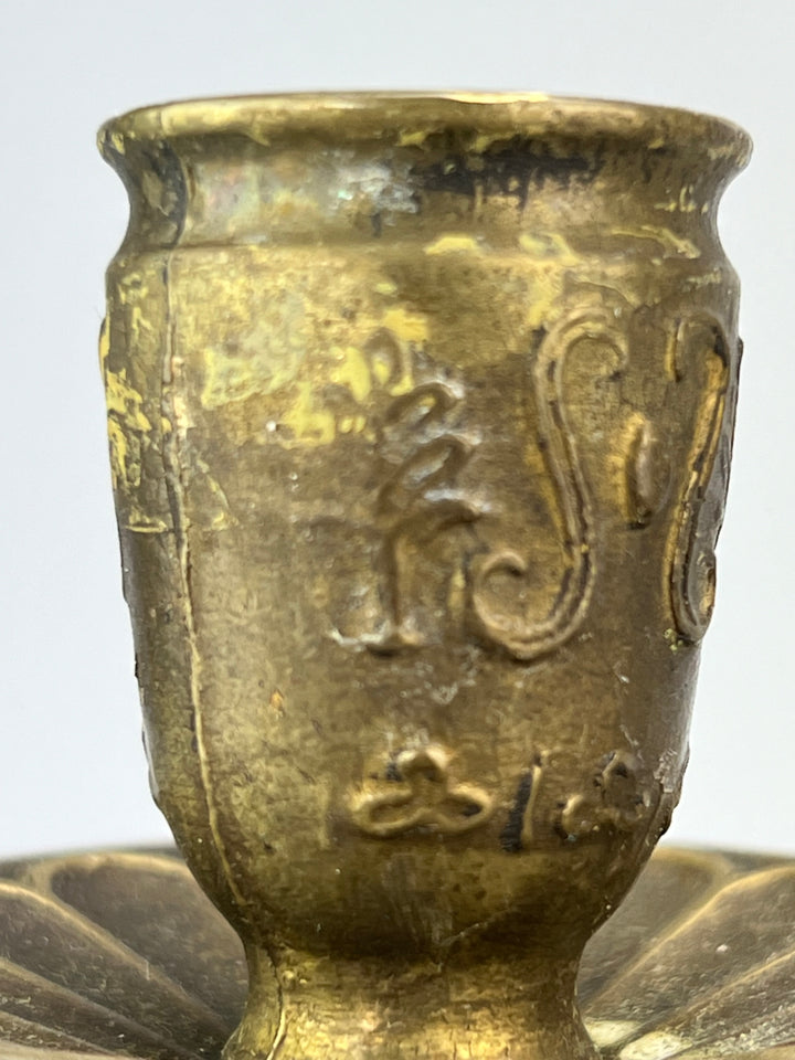 Coppia di putti portacandela in ottone dorato