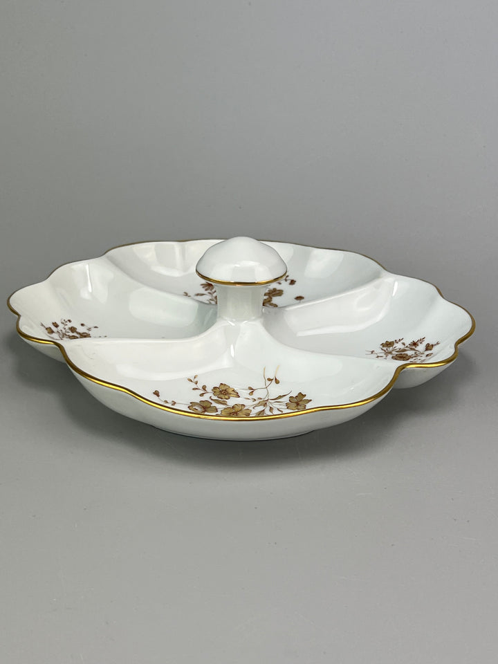 Piatto in porcellana Limoges con decoro dorato