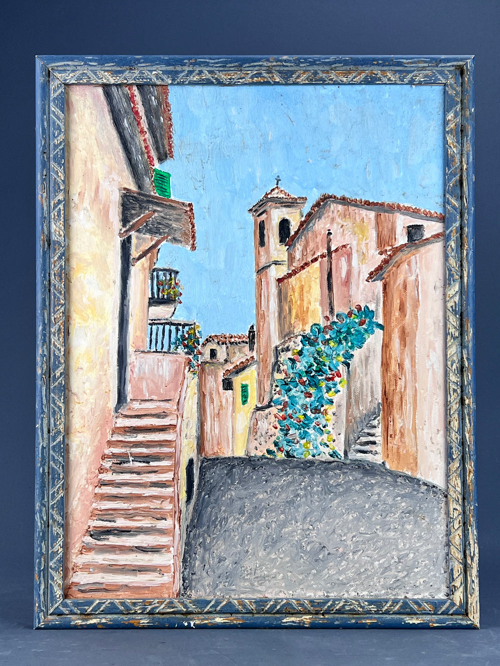 Quadro olio su tela senza firma raffigurante uno scorcio cittadino in cornice di legno sui toni del blu. Misure: 33,5*44 cm