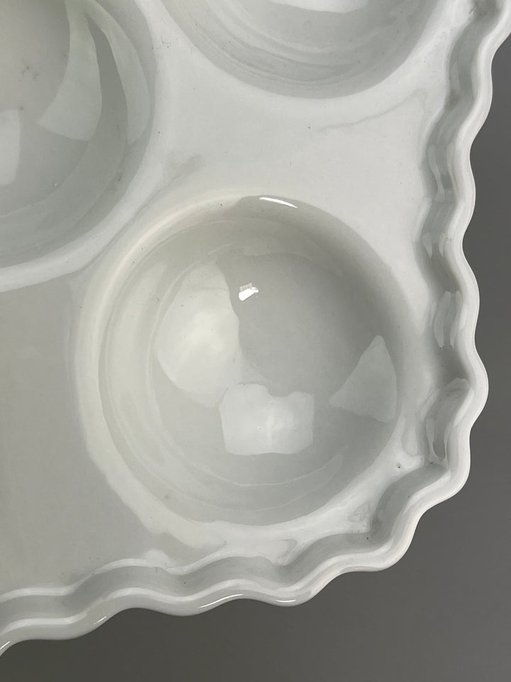 Piatto in porcellana bianca portalumache