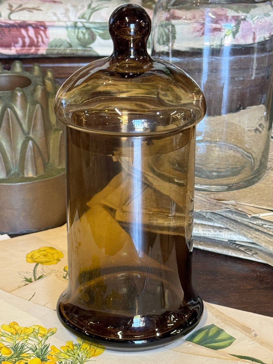 Barattolo vintage in vetro fumé marrone con coperchio originale e pomolo sferico.
