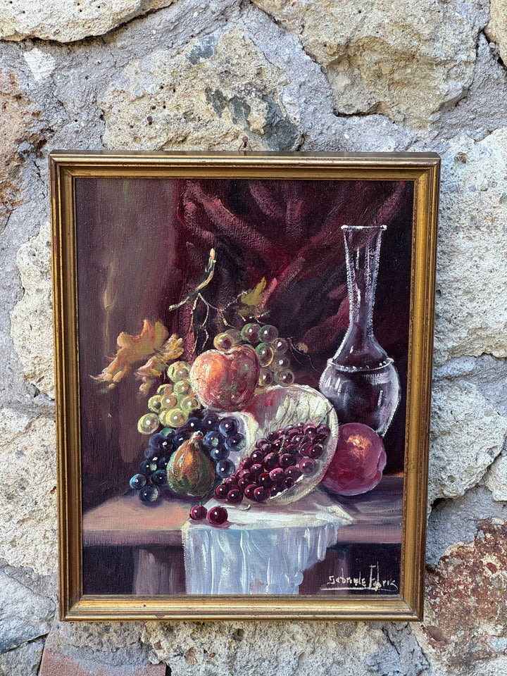 Dipinto a olio su tela raffigurante una natura morta con frutta, ciliegie e caraffa