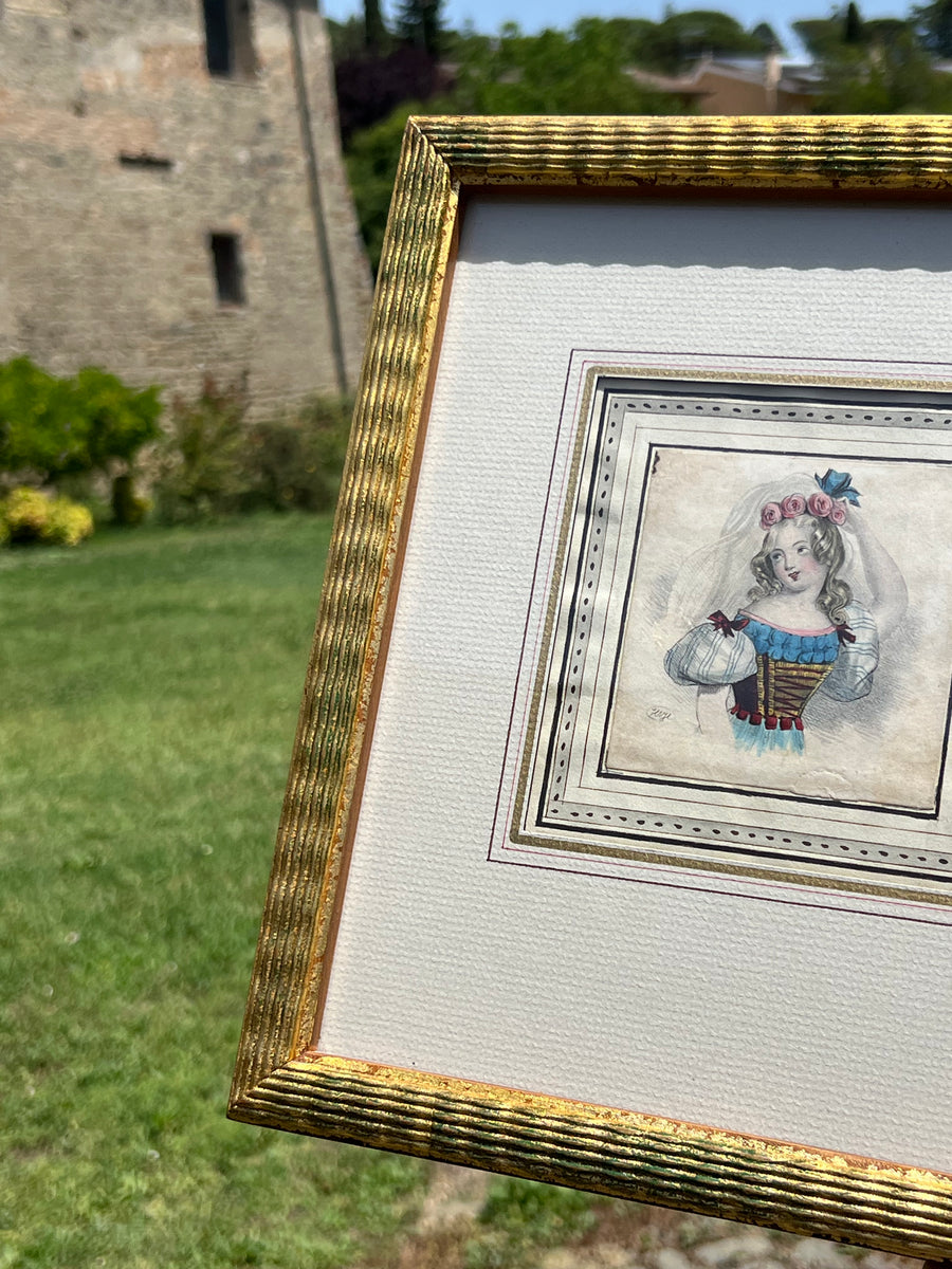 Delicato Disegno a matita su carta con acquarellatura d'epoca della seconda metà dell' Ottocento raffigurante una figura di bimba con cornice in legno dorato.

Misure 27x30,5 cm&nbsp;