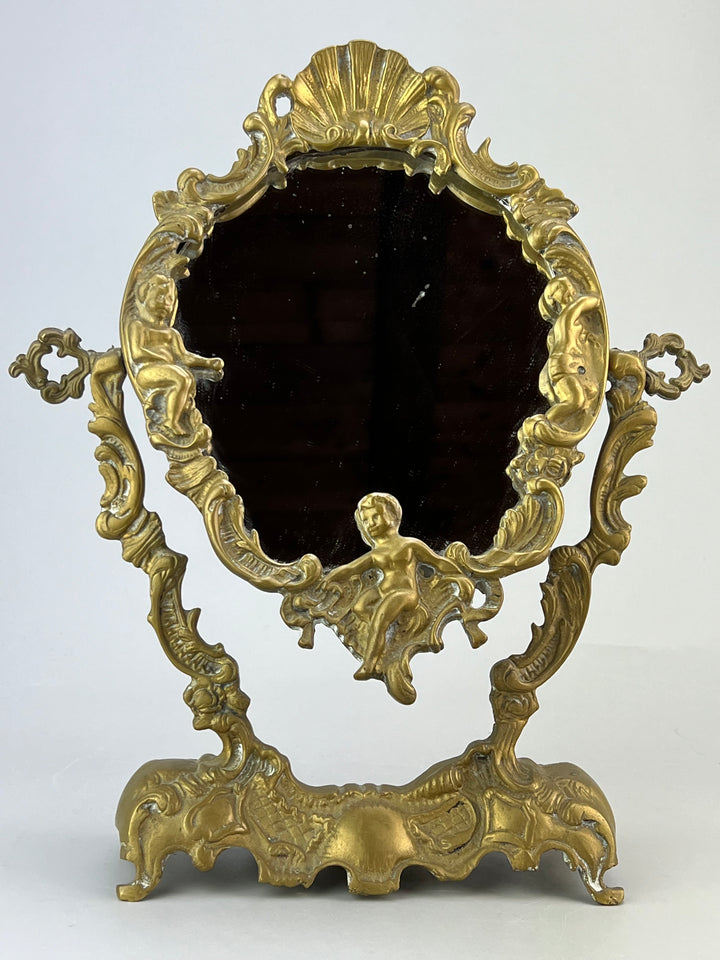 Specchio da tavolo in bronzo dorato con putti stile rococò