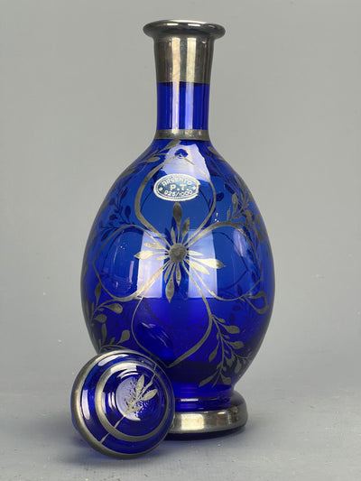 Bottiglia rosolio blu argento