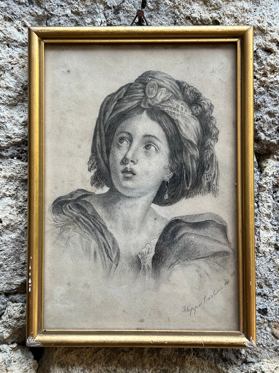 Elegante Ritratto a matita raffigurante una giovane donna, probabilmente Sibilla Cumana sacerdotessa di Apollo realizzato da Filippo Cartoni nel 1885, eseguito con grande attenzione ai dettagli espressivi e alle sfumature.

&nbsp;La cornice dorata aggiunge contrasto all'opera in bianco e nero, ideale per chi cerca un elemento decorativo dal fascino senza tempo.&nbsp;

Misure 15x21 cm