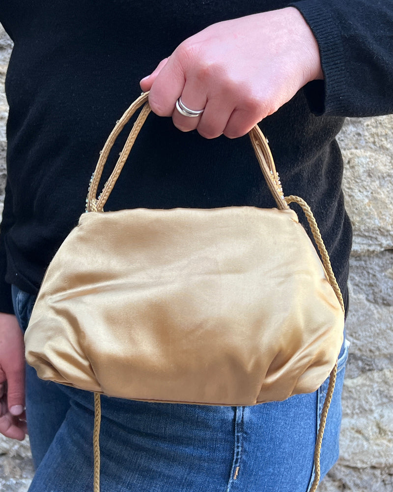 Borsetta da mano in tessuto dorato con perline firmata Rebecca Molenaar vintage.