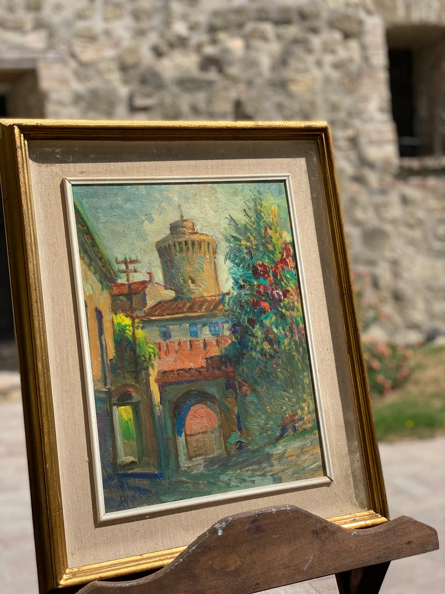 Quadro olio su cartoncino di scorcio di un centro storico firmato da Dino Banchi in basso a sinistra.